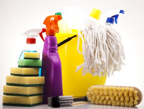 Professional upholstery cleaning equipment in use on a sofa