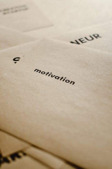 A close-up image of a black surface with white handwritten text that reads, 'Social change is a team effort'. The background appears to be a chalkboard or matte painted surface. The text is arranged w